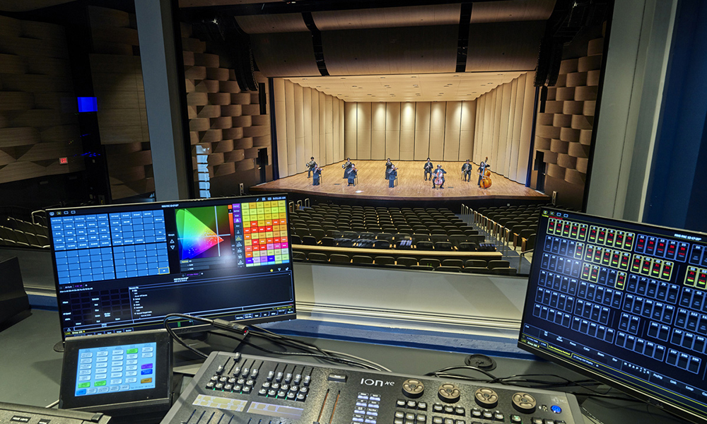 A photo of the AV equipment in front of a performance at Moanaloa High School Performing Arts Center.