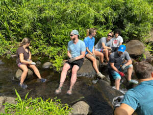 Some of the team relaxing after a community stream restoration effort.
