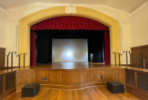 a photo of the stage at the newly renovated Bachelot Hall courtesy of MASON Architecture.