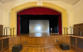 a photo of the stage at the newly renovated Bachelot Hall courtesy of MASON Architecture.