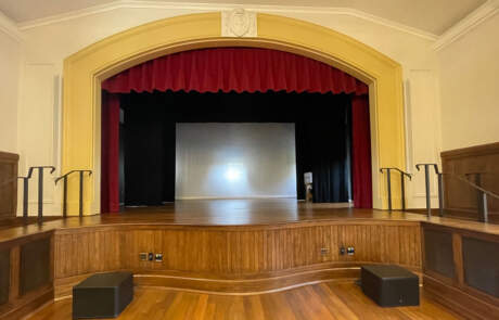 a photo of the stage at the newly renovated Bachelot Hall courtesy of MASON Architecture.